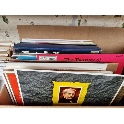 557 - Two boxes containing a collection of vinyl records to include Classical, Film Soundtracks, Comedy, E... 