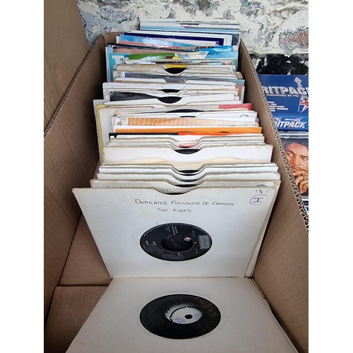 558 - A box containing CDs and 7