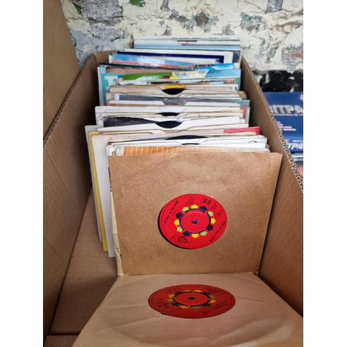 558 - A box containing CDs and 7