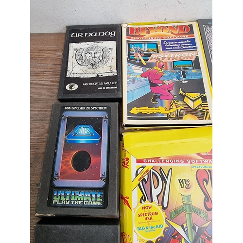 560 - A large collection of Sinclair ZX Spectrum game cassettes to include Alien 8, Sabre Wulf, Knight Lor... 