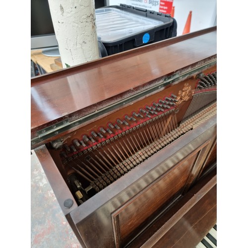 542A - An early 20th century mahogany John Broadwood & Sons upright piano