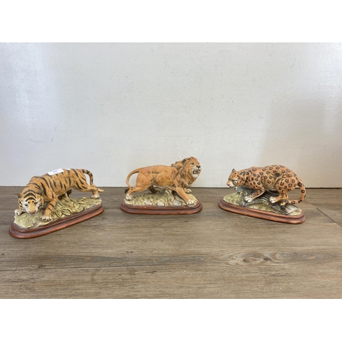 263 - Three ceramic wild cat figurines - largest approx. 16cm high