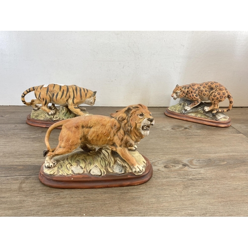 263 - Three ceramic wild cat figurines - largest approx. 16cm high