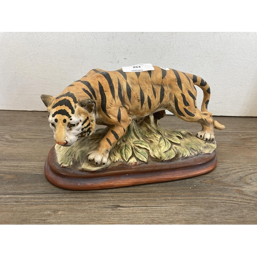 263 - Three ceramic wild cat figurines - largest approx. 16cm high