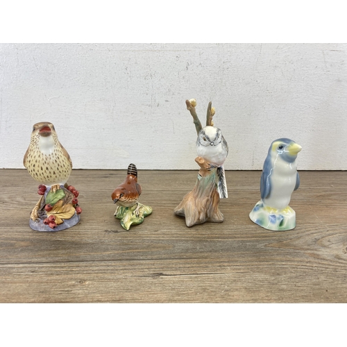 268 - Seven ceramic bird figurines to include Crown Staffordshire no. 277 Long Tail Tit, Beswick Wren, Roy... 