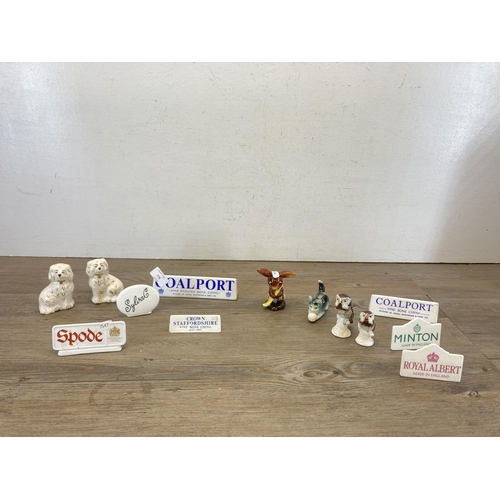 276 - A collection of ceramics to include seven branded advertising plaques, two Beswick miniature Staffor... 