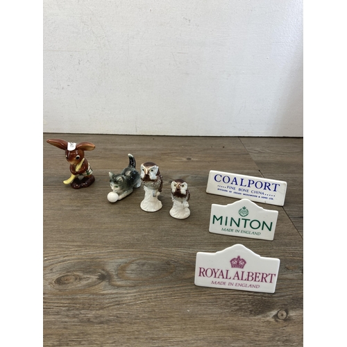 276 - A collection of ceramics to include seven branded advertising plaques, two Beswick miniature Staffor... 