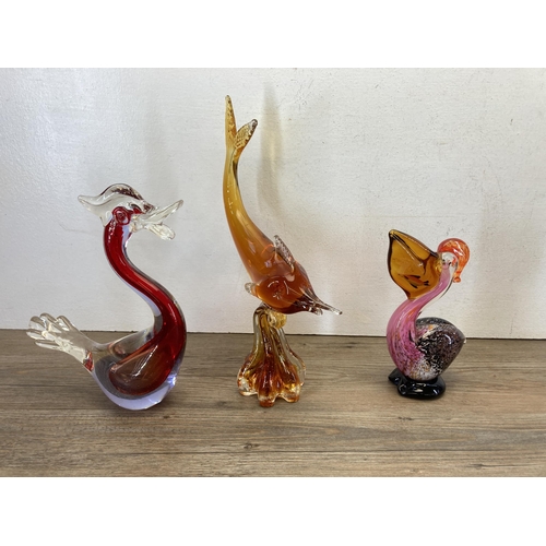 304 - A collection of glass figurines and paperweights to include Wedgwood bird, Wedgwood snail etc.