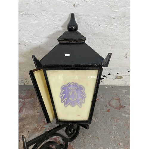 307 - A pair of Victorian style cast metal public house lanterns with opaline effect glass - approx. 98cm ... 