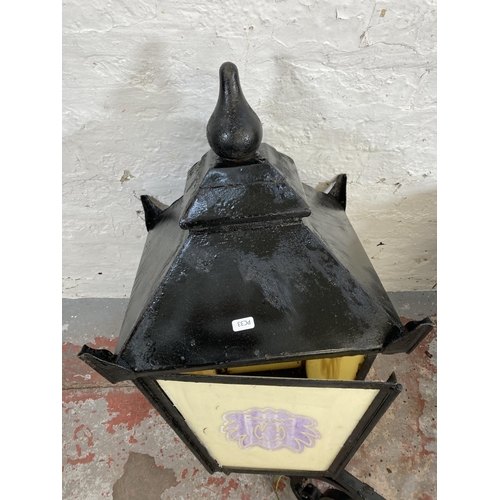 307 - A pair of Victorian style cast metal public house lanterns with opaline effect glass - approx. 98cm ... 