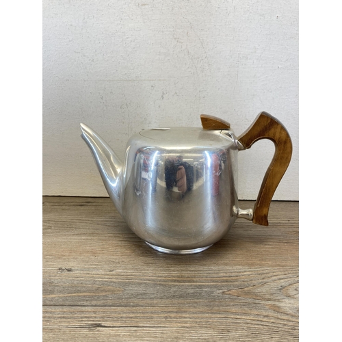 310 - Four pieces of mid 20th century metalware, one soda syphon and three pieces of Picquot Ware