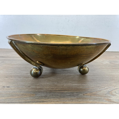 319 - An Arts & Crafts copper semi-globular shaped bowl sitting on three ball feet - approx. 10cm high x 2... 