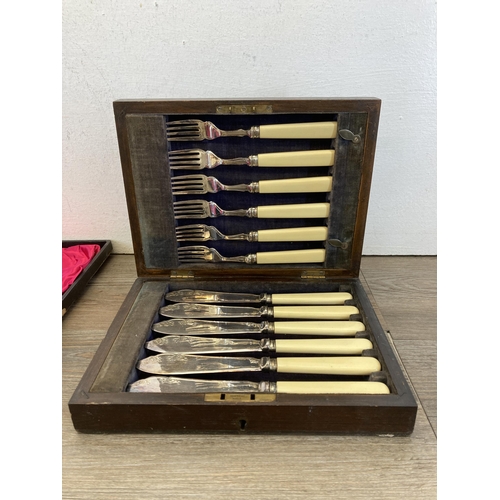 323 - Five vintage cased items, four silver plated cutlery sets and one set of brass Trent Scales