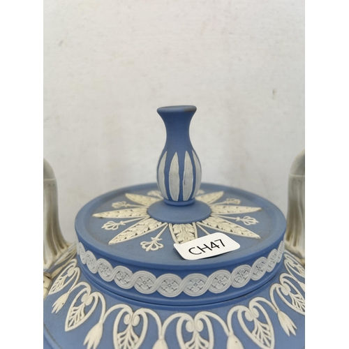 177 - A Wedgwood pale blue Jasperware twin handled urn vase and cover - approx. 30cm high