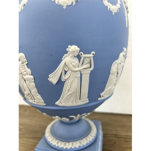 177 - A Wedgwood pale blue Jasperware twin handled urn vase and cover - approx. 30cm high