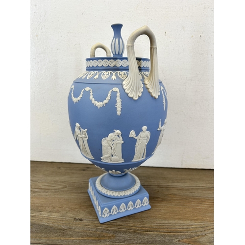 177 - A Wedgwood pale blue Jasperware twin handled urn vase and cover - approx. 30cm high