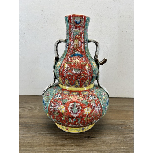 184 - A Chinese Famille Rose twin handled vase - approx. 32cm high