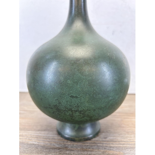 191 - A Japanese patinated bronze bottle neck vase with character mark to base - approx. 24cm high