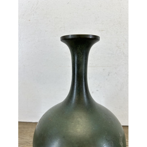 191 - A Japanese patinated bronze bottle neck vase with character mark to base - approx. 24cm high