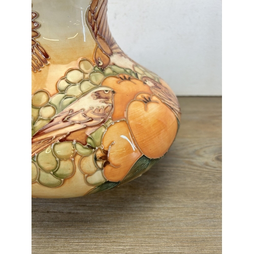 204 - A Moorcroft Pottery Finches and fruit pattern table lamp - approx. 29cm high x 25cm diameter