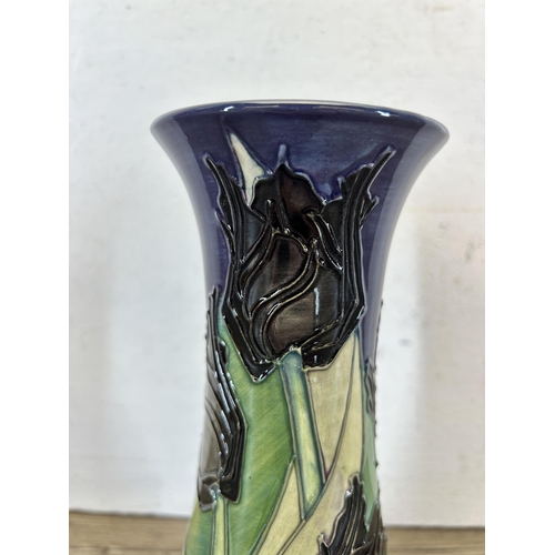 213 - A Moorcroft Pottery Black Tulip pattern vase designed by Sally Tuffin - approx. 20cm high