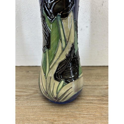 213 - A Moorcroft Pottery Black Tulip pattern vase designed by Sally Tuffin - approx. 20cm high