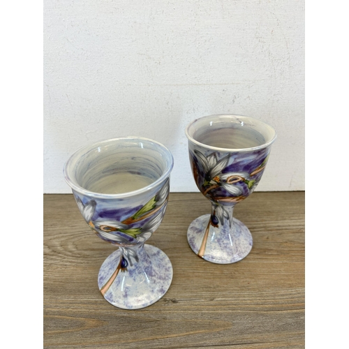 217 - A pair of Cobridge Stoneware Collector's Club 1999 goblets - approx. 16cm high