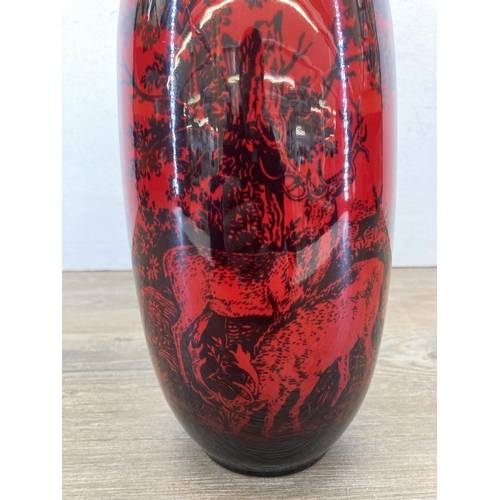 224 - A Royal Doulton Flambé Woodcut no. 1619 vase with stag design - approx. 27cm high