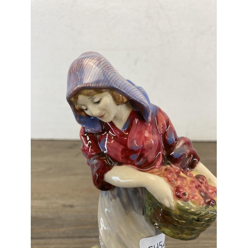 244 - A Royal Doulton Fruit Gathering figurine - HN562