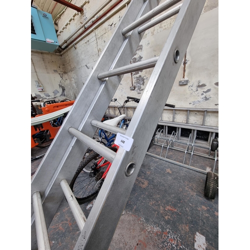 648 - A large set of aluminium ladders