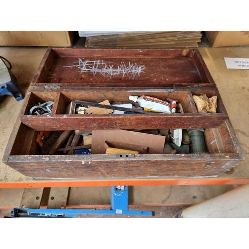 664 - An early 20th Century stained  pine tools chest containing vintage tools