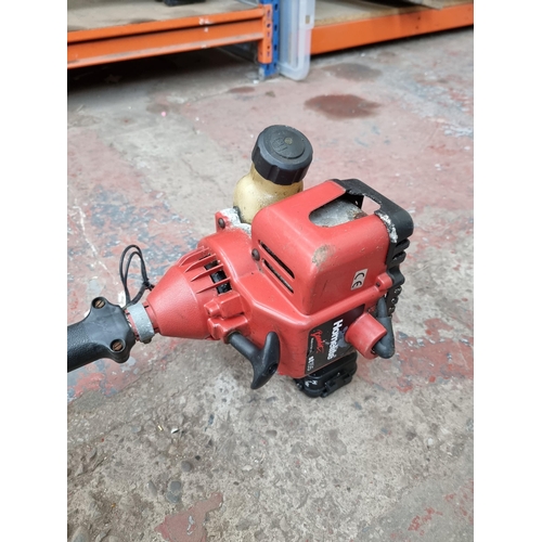 668 - A Homelite Bandit ST155 petrol strimmer