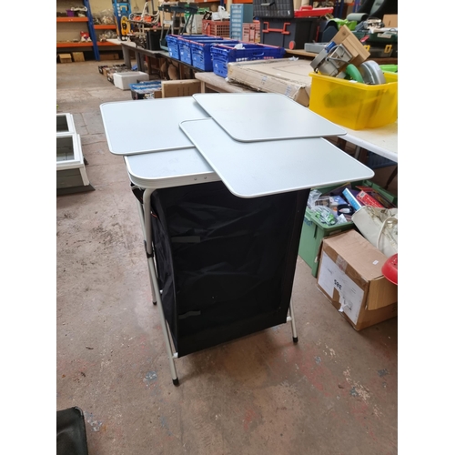 695 - A Vango 3 shelf folding camping kitchen