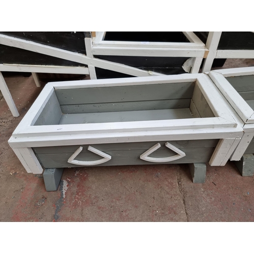 716 - A pair of white and grey painted wooden rectangular garden planters both - approx. 28cm high x 77cm ... 