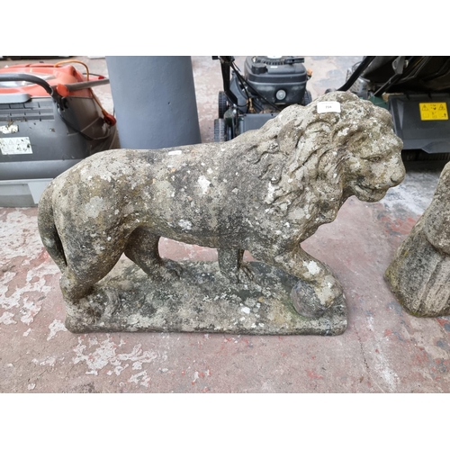 734 - A cast stone Medici lion statue - approx. 54cm high x 71cm long x 24cm deep