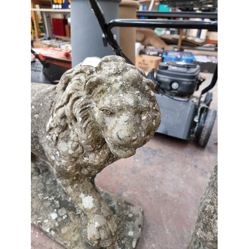 734 - A cast stone Medici lion statue - approx. 54cm high x 71cm long x 24cm deep