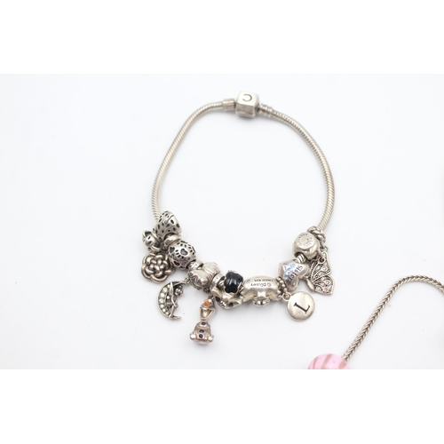 1157 - Three .925 silver charm bracelets with charms - approx. gross weight 139 grams