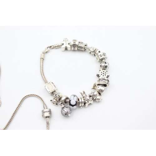 1157 - Three .925 silver charm bracelets with charms - approx. gross weight 139 grams