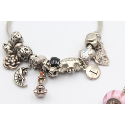 1157 - Three .925 silver charm bracelets with charms - approx. gross weight 139 grams