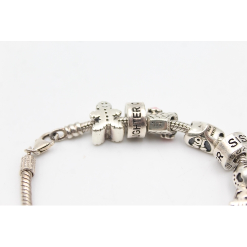 1157 - Three .925 silver charm bracelets with charms - approx. gross weight 139 grams