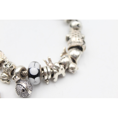 1157 - Three .925 silver charm bracelets with charms - approx. gross weight 139 grams