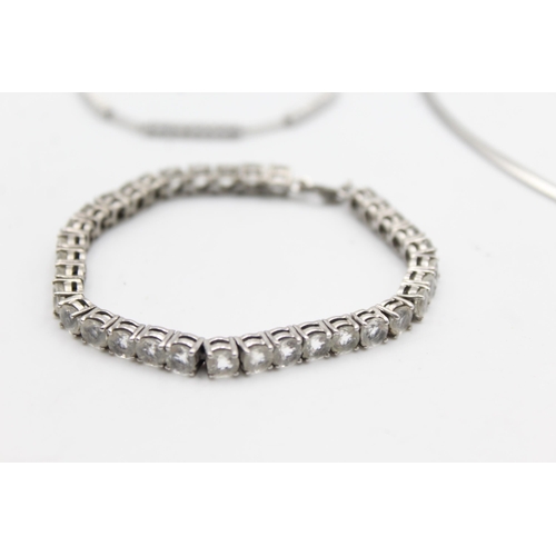 1166 - Three pieces of .925 silver jewellery, two tennis bracelets and one statement necklace - approx. gro... 