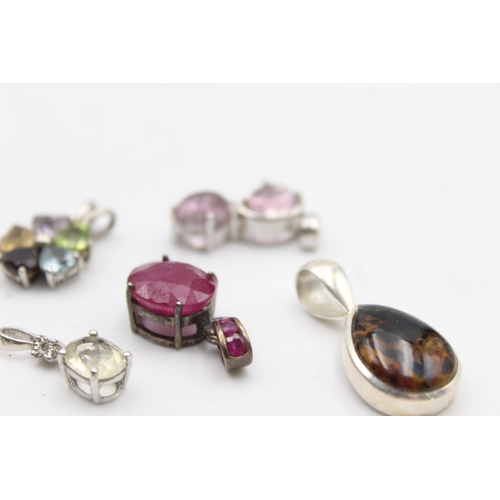 1170 - Twelve .925 silver gemstone set pendants to include TGGC etc. - approx. gross weight 41 grams