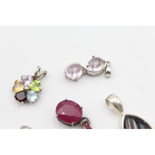 1170 - Twelve .925 silver gemstone set pendants to include TGGC etc. - approx. gross weight 41 grams