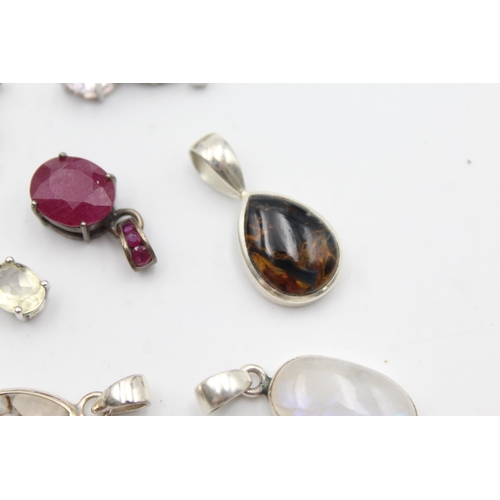 1170 - Twelve .925 silver gemstone set pendants to include TGGC etc. - approx. gross weight 41 grams