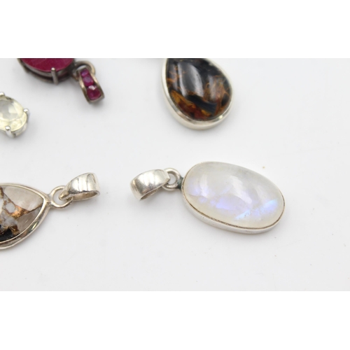 1170 - Twelve .925 silver gemstone set pendants to include TGGC etc. - approx. gross weight 41 grams