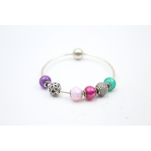 1171 - Five Pandora .925 silver bracelets with assorted charms - approx. gross weight 85 grams