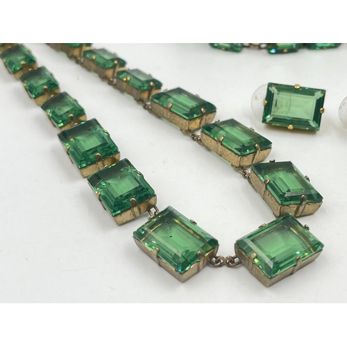 1193 - An Art Deco style Sarah Booth green paste and brass three piece jewellery set