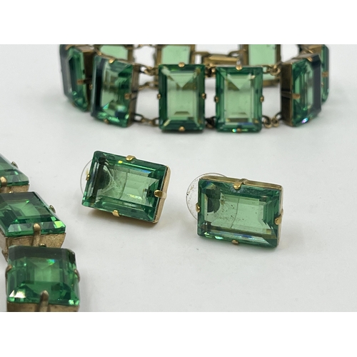 1193 - An Art Deco style Sarah Booth green paste and brass three piece jewellery set