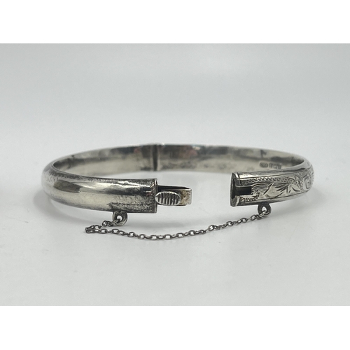 1196 - Two pieces of hallmarked sterling silver, one Chester napkin ring and one Birmingham bangle - approx... 